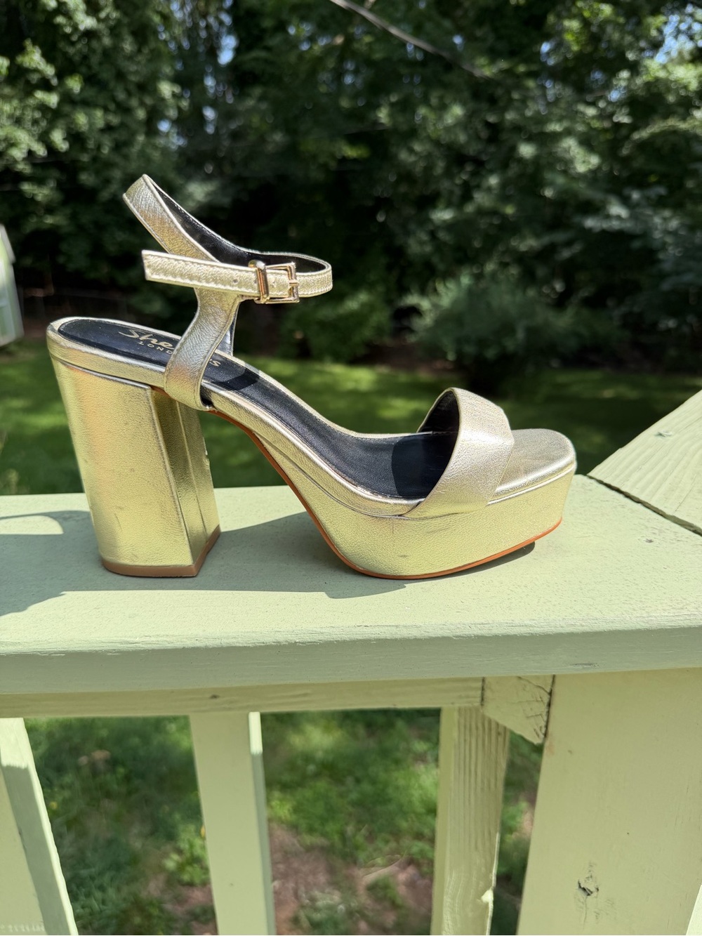 Gold platform heeled sandal with ankle strap